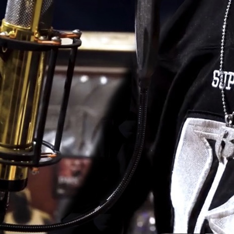 a person standing in front of mic